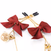 SM sex toys, bow-shaped nipple clamps, chest chain with bell nipple clamps