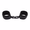 A pair of handcuffs made of neoprene and webbing, black.