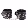 A pair of black handcuffs