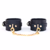 Leather handcuffs with gold chains