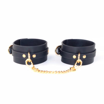 Leather shackles with gold chains
