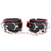 Black and red handcuffs with metal chains