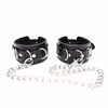 Black leg irons with metal chains