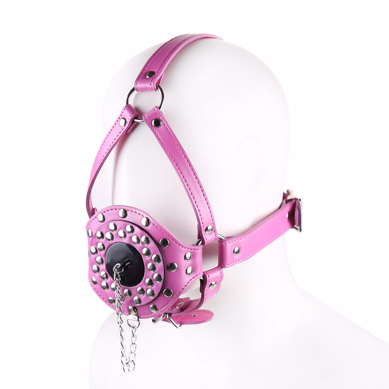 The toilet seat plug in the shape of a horse harness is dark pink.