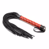A red leather whip with a textured surface.