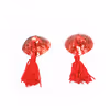 Tassel-shaped nipple covers with sequins, all red