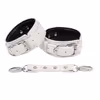 White leather handcuffs and leg irons
