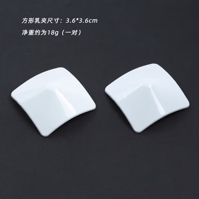 Square-shaped white metal nipple covers