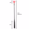 Red heart-shaped leather whip with black woven handle