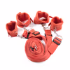 Red plush bed restraint straps