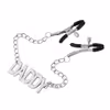 Chain nipple clamps with the letter DADDY