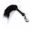 A fluffy tail with a whip, black with a white tip.
