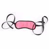 Pink three-piece set of handcuffs, whip, and blindfold