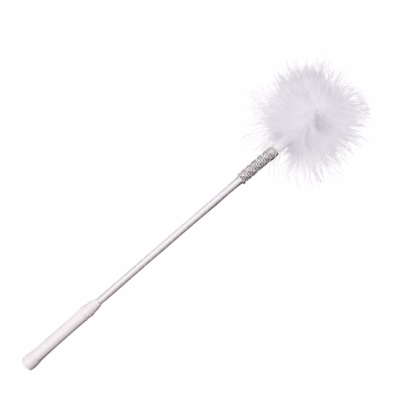 White feathers wrapped in satin ribbons and inlaid with rhinestones.