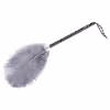 Gray ostrich feathers wrapped around a black and white handle
