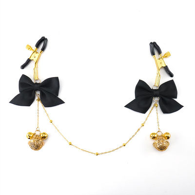 SM sex toys, bow-shaped nipple clamps, chest chain with bell nipple clamps