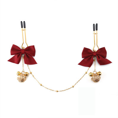 SM sex toys, bow-shaped nipple clamps, chest chain with bell nipple clamps